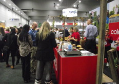 Chefs at the Coles stand prepare food for attendees to sample.