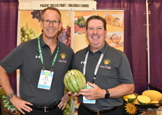 Josh Leichter and Howard Nager with Pacific Trellis Fruit, holding a personal size melon.