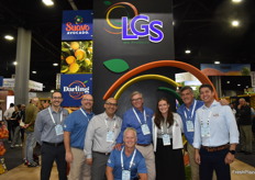 Smiles in the booth of LGS Specialty Sales. From left to right Lucio Rainelli, James Rasmussen, Juan Monsalve, Pete Creager, Luke Sears, Taylor Sears, Gonzalo Bertran, and Juan Carlos Alvarado. 