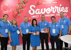 Team Mucci Farms proudly shows their Savorries Sweet Strawberry Tomatoes, a successful product for the company. 