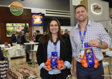 Sarah Deaton and Anders Schraer with Sun Pacific proudly show Cuties mandarins.