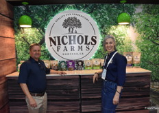 Andy Felts and Christine Trageser with Nichols Farms in front of their pistachio and almond products.