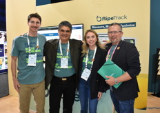 Posing in front of the RipeTrack display are Nate August, Renzo Ostolaza, Julianna St. Geme, and William Ison with Apeel Sciences. 