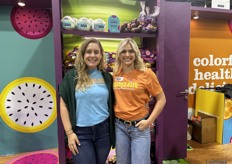 Alex Jackson and Sarah Ardantz with Frieda’s colorful booth filled with equally colorful produce.