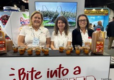 Riveridge Produce Marketing’s Kari Soldaat, Trish Taylor and Marilyn Heerren hand out samples of the company’s apple cider.