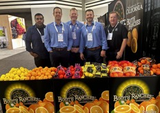 The Booth Ranches, LLC. team behind an array of its citrus.