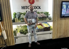 Shane Moreno of Hitchcock Farms shows off the company’s purple Brussels sprouts.