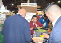 Bryan Cano from Grande Produce serves guacamole, which was very popular at the show. They were part of the Texas Town pavilion.