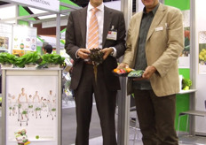 Jan Doldersum (left) showing a head of Salanova lettuce.