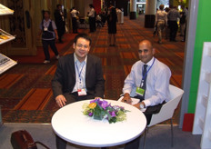 Mike Su (left) of San Long from China, speaking to a business partner.