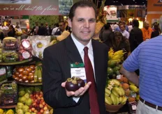 Robert Schueller of Melissa's shows a mangosteen. This fruit is now allowed into the United States, and Melissa's will run an import program with the new crop from Thailand starting May 2008.