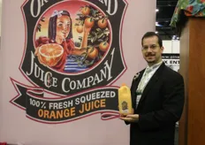David Cortez of Orchid Island Juice Company showing his 100% fresh squeezed orange juice