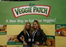 Beautiful ladies in the booth of Veggie Patch. One of them is Miss Hawaiian Tropic. Which one do you guess?