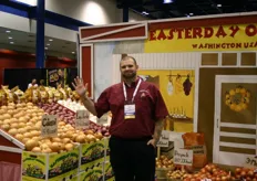 Mason Garrison of Easterday Farms welcomes everybody at his booth