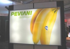 A display panel at Peviani stand shows a Fyffes branded banana bunch.