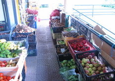 A fruit and vegetable stand at an indoor market place in Ribiera Brava.