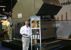 Don Lawrence of JBT FoodTech promoting their Food-Grade Lubricants and behind him the JBT FoodTech Bin Scrubber System