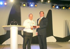 "John Groh handed out the "The Produce News Fresh Health Award" to Larry McIntosh of Peak of the Market."