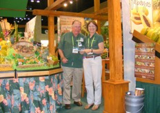 Mary Ostlund and colleague of Brooks Tropicals presents the award for the best Island Booth they won at Fresh Summit this year