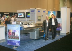 Massimo Marangoni and Valerio Pollini of Unitec next to Unical_200 Cherry. The machine sorts cherries by color and size. The machine can be extended with an application that detects sugarrate and external defects.