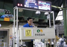 "the "auctioneer" at the Garak market"