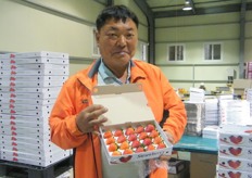 Korean strawberry farmer proudto show his strawberries