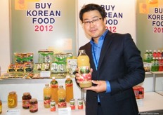 Gyeong Buk Corporation´s Assistant Manager, Mr. Byung Woo, offers mini-tomato, strawberry, pear, apple and watermelon