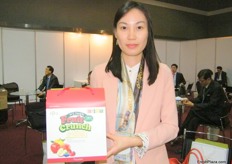 "Ms. Soon Il Bang, Marketing/Public Relation Team and Assistant of Natural Choice offering "Fruit Crunch" as their new product. Natural Choice is also known for their freeze-dried fruit snacks and fruit jams that have no artificial additives."