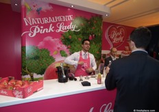 Cesar Balades serving up apple juice on the Pink Lady stand.