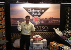 Ken Christopher of Christopher Ranch, showing his company's specisality garlic.