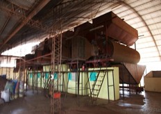 In order to open the nut shells, they first have to be dried. This huge drying line is required for the drying process under artificial circumstances.