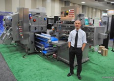 Ascari Luca from ABL standing besides their Mango Destoner. It is the only machine in the world. This machine needs a fifth less workers, lowers risk of contamination, higher speed of destoning, 50% extra yield.