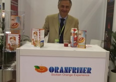 Salvo Laudani from Oranfrizer, shows the blood orange juice at the stand.