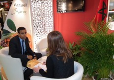 Abdelhamid Achwaq, Senior Advisor to the Center for Export Promotion of the Kingdom of Morocco, in conversation with a visitor.