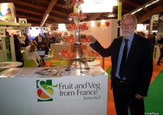 Bruno Dupont, President of Interfel, Les Fruits et Légumes Frais, next to his apricot Eiffel Tower.