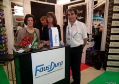 Romain Faus and Flavien Faus with a colleague in their Faus Dura stand, French company that imports and exports fruits.